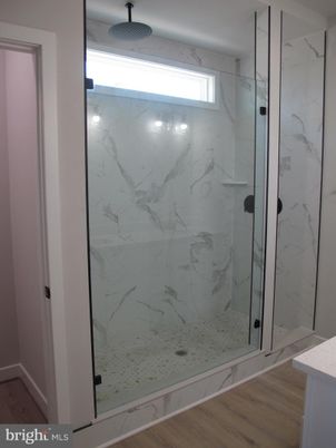 Bathroom, Glass Shower, Interior, Marble Walls, Wood Texture Flooring