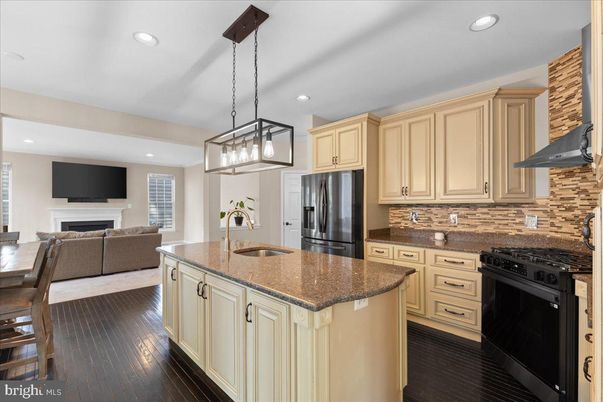 Dining room, Fireplace, Interior, Kitchen, Living room, Pendant Lights, Recessed Lighting, Stainless Steel Appliances, Wood Texture Flooring