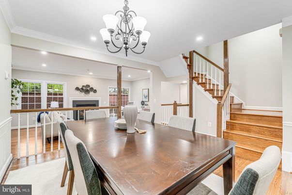 Chandelier, Dining room, Fireplace, Interior, Living room, Recessed Lighting, Wood Texture Flooring
