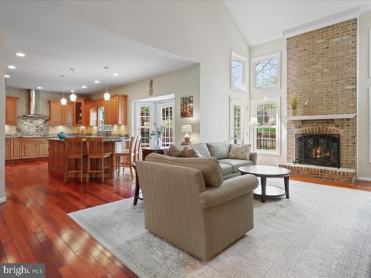 Fireplace, Interior, Kitchen, Living room, Pendant Lights, Recessed Lighting, Stainless Steel Appliances, Stone Walls, Wood Texture Flooring
