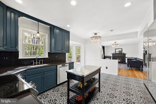 Chandelier, Fireplace, Interior, Kitchen, Pendant Lights, Recessed Lighting, Stainless Steel Appliances, Wood Texture Flooring