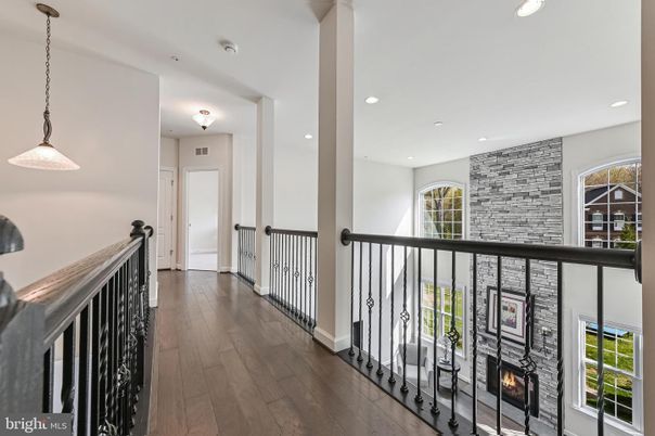 Fireplace, Interior, Pendant Lights, Recessed Lighting, Stone Walls, Wood Texture Flooring