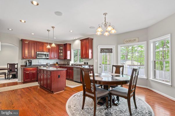 Chandelier, Dining room, Interior, Kitchen, Pendant Lights, Recessed Lighting, Stainless Steel Appliances, Wood Texture Flooring