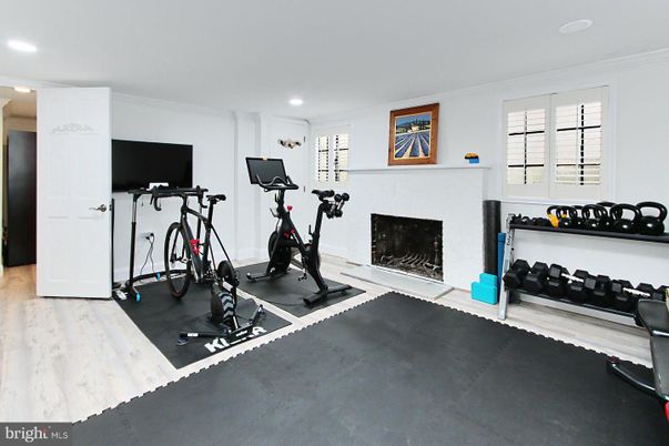 Fireplace, Fitness Equipment, Interior, Recessed Lighting, Wood Texture Flooring