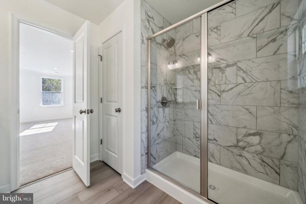 Bathroom, Glass Shower, Interior, Marble Walls, Recessed Lighting, Wood Texture Flooring