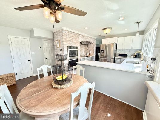 Dining room, Interior, Kitchen, Pendant Lights, Recessed Lighting, Stainless Steel Appliances, Stone Walls, Wood Texture Flooring