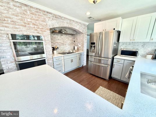 Interior, Kitchen, Recessed Lighting, Stainless Steel Appliances, Stone Walls, Wood Texture Flooring