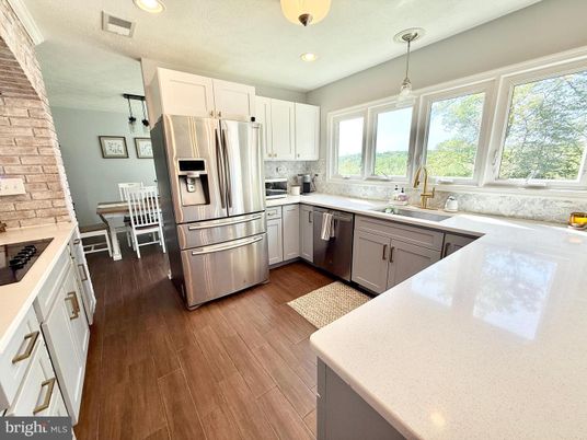 Dining room, Interior, Kitchen, Pendant Lights, Recessed Lighting, Stainless Steel Appliances, Wood Texture Flooring