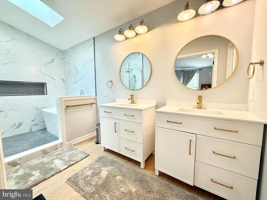 Bathroom, Dual Sink Vanities, Interior, Marble Walls, Wood Texture Flooring