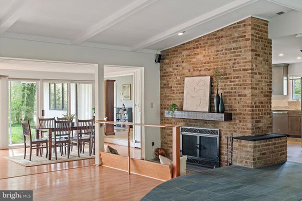 Dining room, Fireplace, Interior, Recessed Lighting, Stone Walls, Wood Texture Flooring