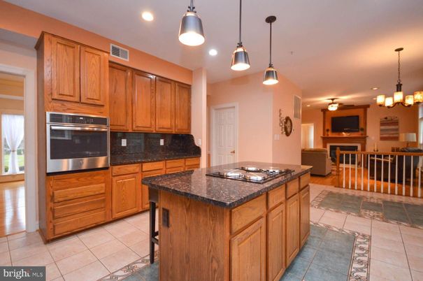 Chandelier, Dining room, Fireplace, Interior, Kitchen, Pendant Lights, Recessed Lighting, Stainless Steel Appliances
