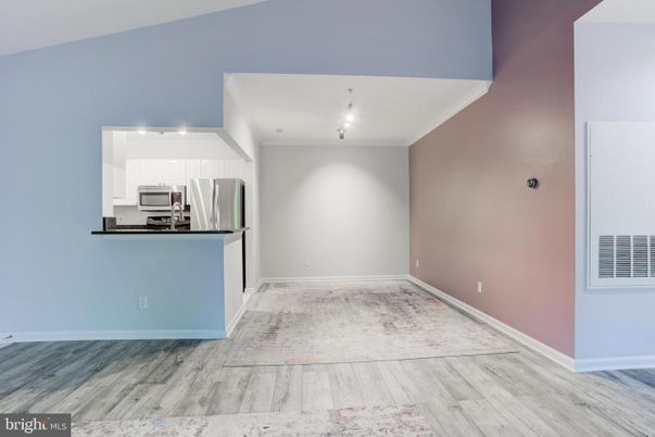 Empty room, Interior, Kitchen, Stainless Steel Appliances, Wood Texture Flooring