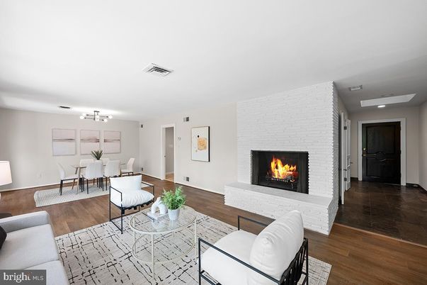 Dining room, Fireplace, Interior, Living room, Recessed Lighting, Stone Walls, Wood Texture Flooring