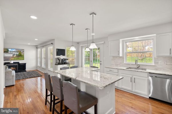 Fireplace, Interior, Kitchen, Pendant Lights, Recessed Lighting, Stainless Steel Appliances, Wood Texture Flooring