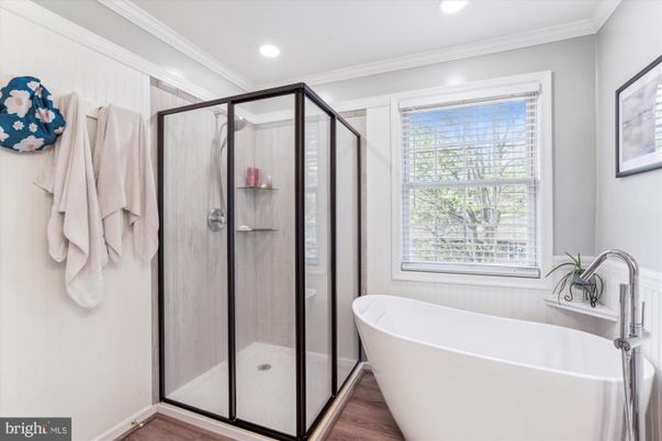 Bathroom, Free Standing Baths, Glass Shower, Interior, Recessed Lighting, Wood Texture Flooring