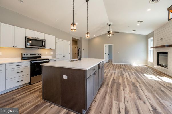Fireplace, Interior, Kitchen, Pendant Lights, Recessed Lighting, Stainless Steel Appliances, Wood Texture Flooring