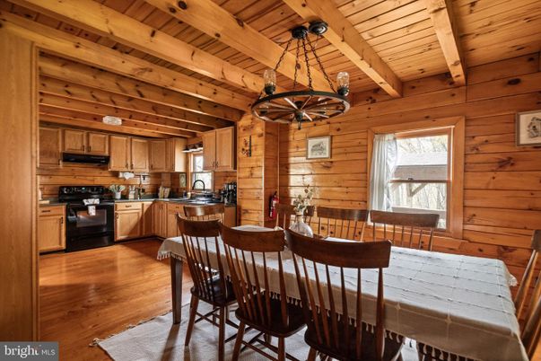 Chandelier, Dining room, Interior, Kitchen, Stainless Steel Appliances, Wooden Beams, Wooden Ceilings, Wood Texture Flooring, Wooden Walls