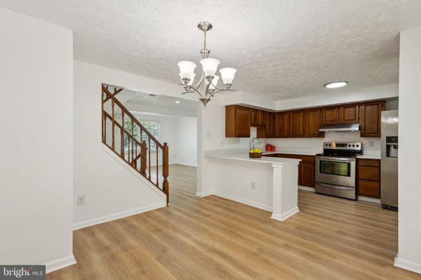 Chandelier, Interior, Kitchen, Recessed Lighting, Stainless Steel Appliances, Wood Texture Flooring