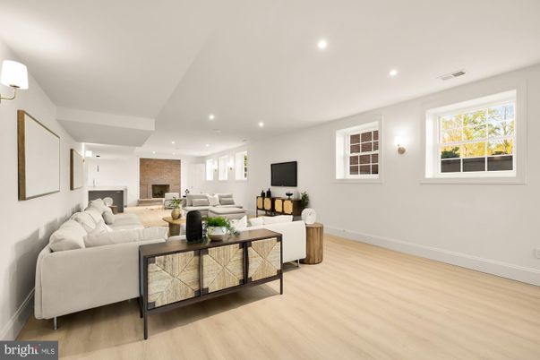 Fireplace, Interior, Living room, Recessed Lighting, Stone Walls, Wood Texture Flooring