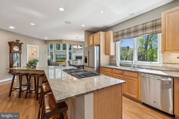 Chandelier, Dining room, Interior, Kitchen, Recessed Lighting, Stainless Steel Appliances, Wood Texture Flooring