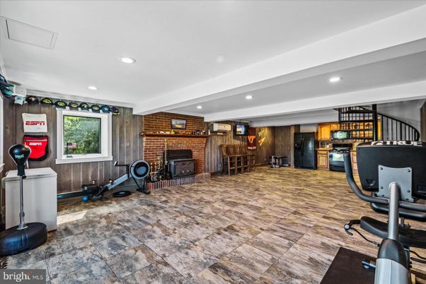 Fireplace, Fitness Equipment, Interior, Recessed Lighting, Stone Walls, Wooden Walls