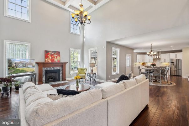 Chandelier, Dining room, Fireplace, Interior, Kitchen, Living room, Recessed Lighting, Stainless Steel Appliances, Wood Texture Flooring