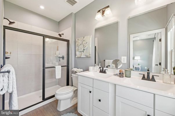 Bathroom, Dual Sink Vanities, Glass Shower, Interior, Recessed Lighting, Wood Texture Flooring