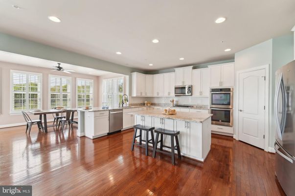 Dining room, Interior, Kitchen, Recessed Lighting, Stainless Steel Appliances, Wood Texture Flooring