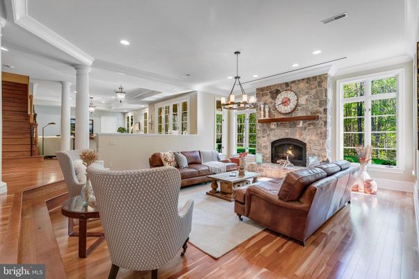 Fireplace, Interior, Living room, Pendant Lights, Recessed Lighting, Stone Walls, Wood Texture Flooring