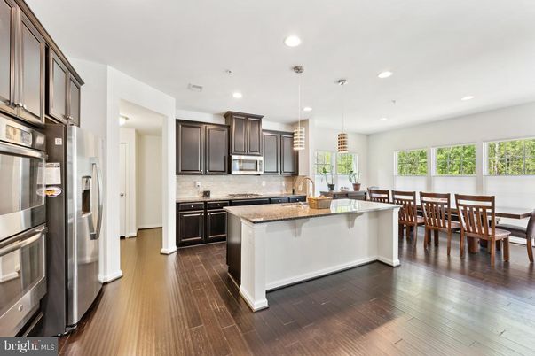Dining room, Interior, Kitchen, Pendant Lights, Recessed Lighting, Stainless Steel Appliances, Wood Texture Flooring