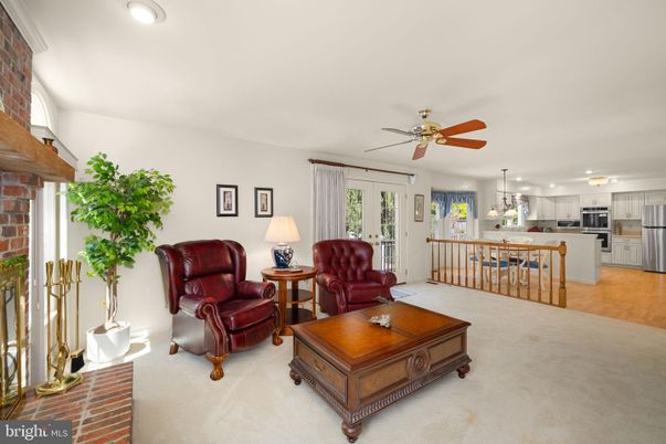 Fireplace, Interior, Kitchen, Living room, Pendant Lights, Stainless Steel Appliances, Stone Walls, Wood Texture Flooring