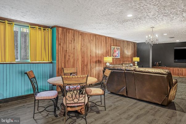 Chandelier, Dining room, Interior, Living room, Recessed Lighting, Wood Texture Flooring, Wooden Walls