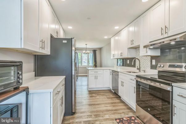 Chandelier, Interior, Kitchen, Pendant Lights, Recessed Lighting, Stainless Steel Appliances, Wood Texture Flooring