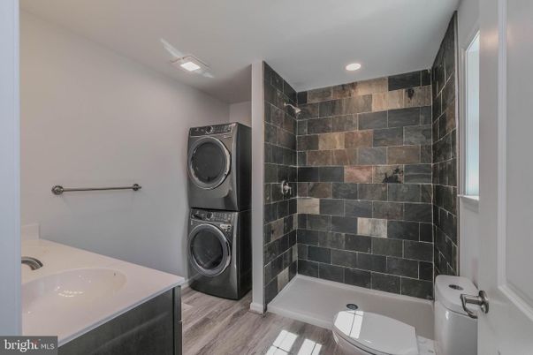 Bathroom, Interior, Recessed Lighting, Washer, Wood Texture Flooring