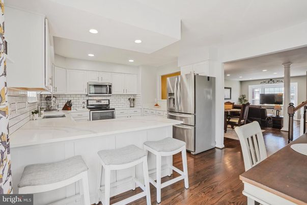 Dining room, Interior, Kitchen, Recessed Lighting, Stainless Steel Appliances, Wood Texture Flooring