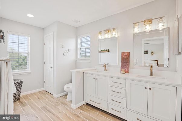 Bathroom, Dual Sink Vanities, Interior, Recessed Lighting, Wood Texture Flooring
