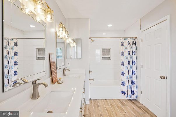 Bathroom, Dual Sink Vanities, Interior, Recessed Lighting, Wood Texture Flooring