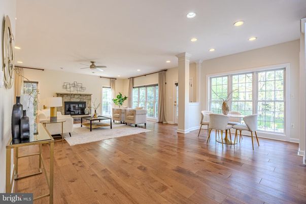 Dining room, Fireplace, Interior, Living room, Recessed Lighting, Wood Texture Flooring
