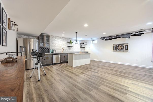 Interior, Kitchen, Pendant Lights, Recessed Lighting, Stainless Steel Appliances, Stone Walls, Wood Texture Flooring