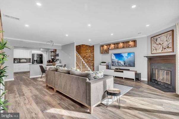 Fireplace, Interior, Kitchen, Living room, Recessed Lighting, Stainless Steel Appliances, Stone Walls, Wood Texture Flooring