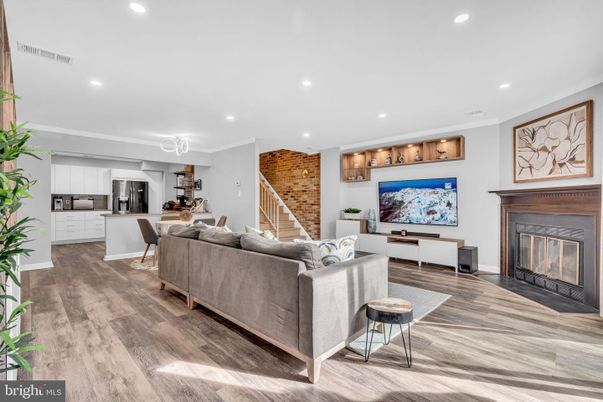 Fireplace, Interior, Kitchen, Living room, Recessed Lighting, Stainless Steel Appliances, Stone Walls, Wood Texture Flooring