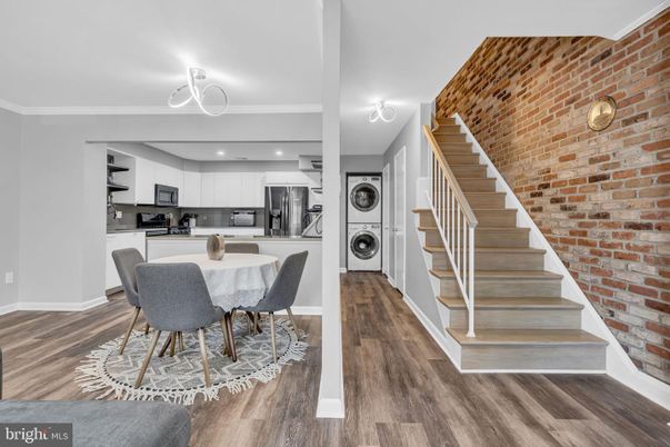 Dining room, Interior, Kitchen, Recessed Lighting, Stainless Steel Appliances, Stone Walls, Wood Texture Flooring
