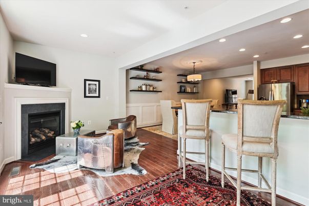 Dining room, Fireplace, Interior, Kitchen, Recessed Lighting, Stainless Steel Appliances, Wood Texture Flooring