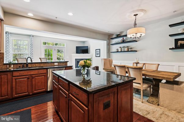 Chandelier, Dining room, Fireplace, Interior, Kitchen, Recessed Lighting, Wood Texture Flooring