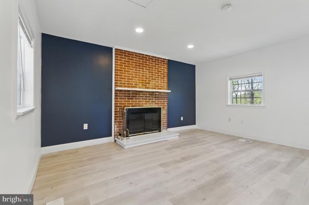 Empty room, Fireplace, Interior, Recessed Lighting, Stone Walls, Wood Texture Flooring
