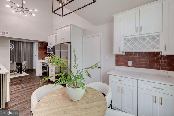 Dining room, Interior, Kitchen, Pendant Lights, Stainless Steel Appliances, Stone Walls, Wood Texture Flooring