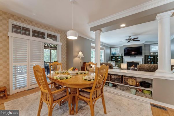 Dining room, Fireplace, Interior, Pendant Lights, Recessed Lighting, Stone Walls, Wood Texture Flooring