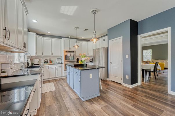 Dining room, Interior, Kitchen, Pendant Lights, Recessed Lighting, Stainless Steel Appliances, Wood Texture Flooring