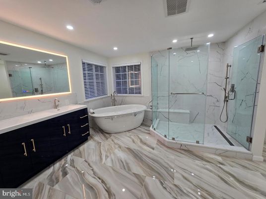Bathroom, Dual Sink Vanities, Free Standing Baths, Glass Shower, Interior, Marble, Marble Walls, Recessed Lighting