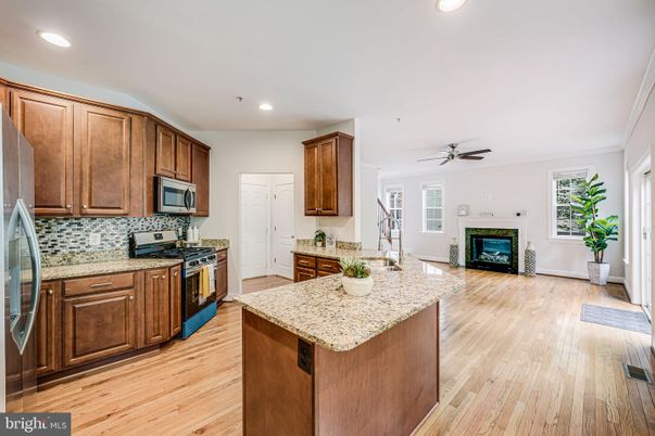 Fireplace, Interior, Kitchen, Recessed Lighting, Wood Texture Flooring